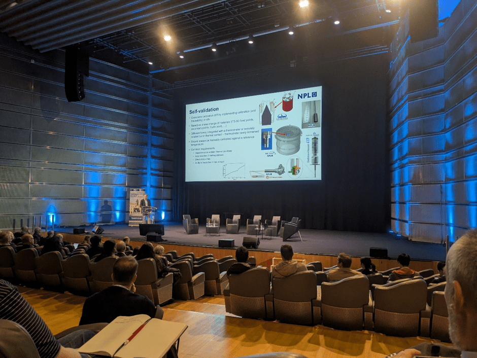 The main presentation stage at TEMPMEKO with a talk on self-validating thermocouples in progress
